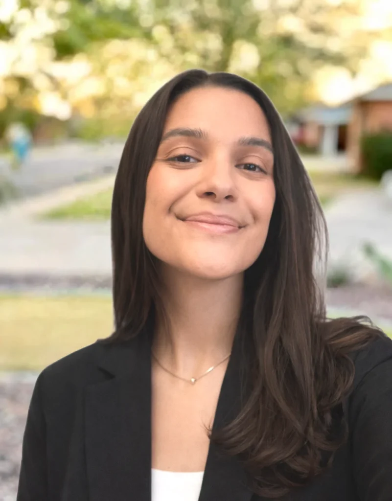 Smiling woman outdoors in formal attire